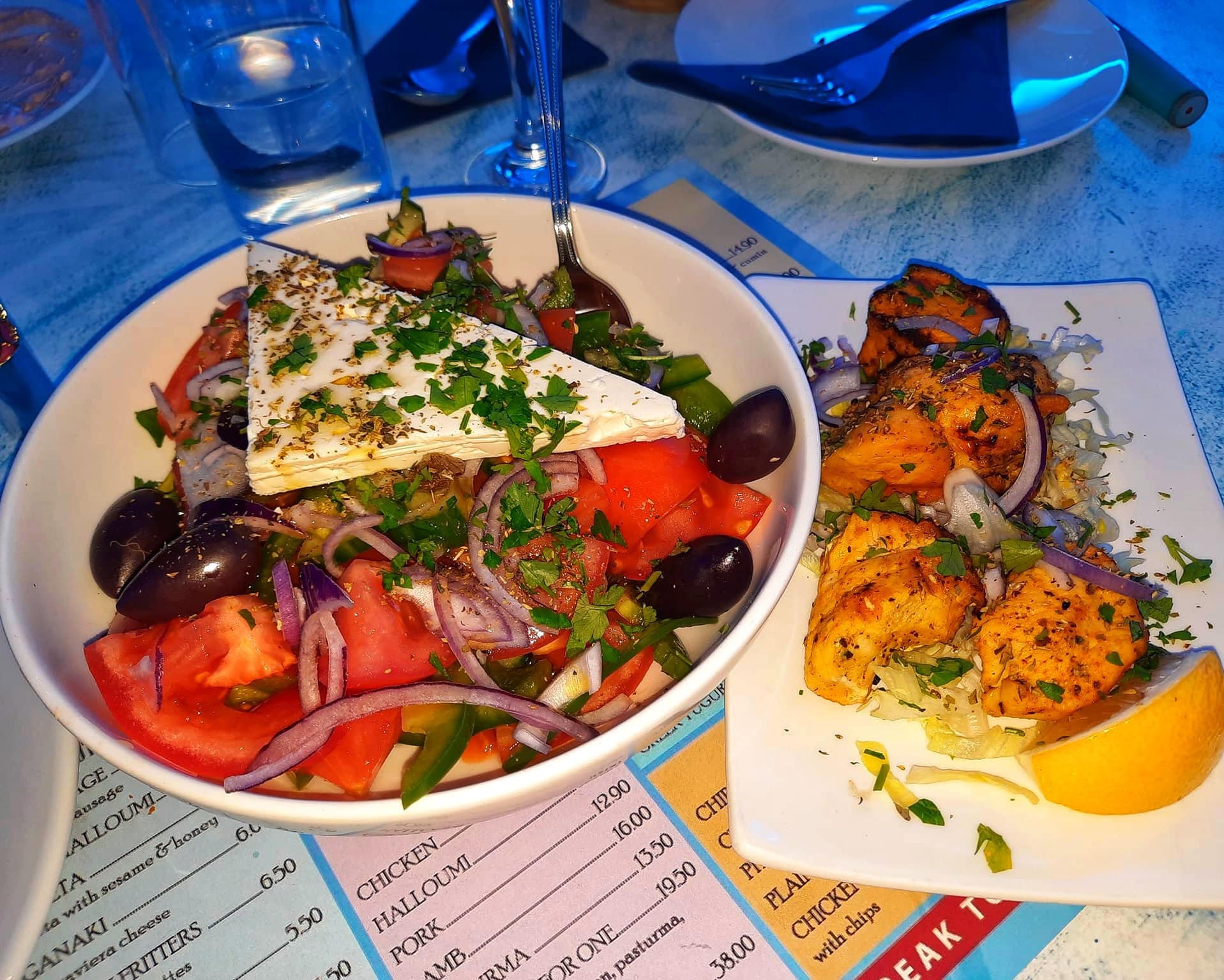 Close up greek salad and souvlaki