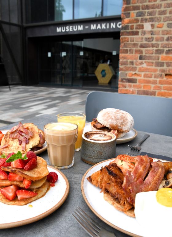 A variety of breakfast foods outside the Museum of Making
